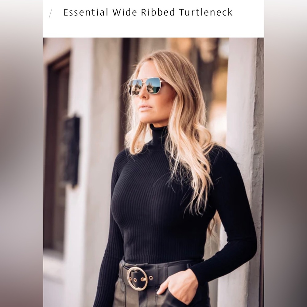 Brand new black ribbed turtleneck - never worn, still in original packaging.